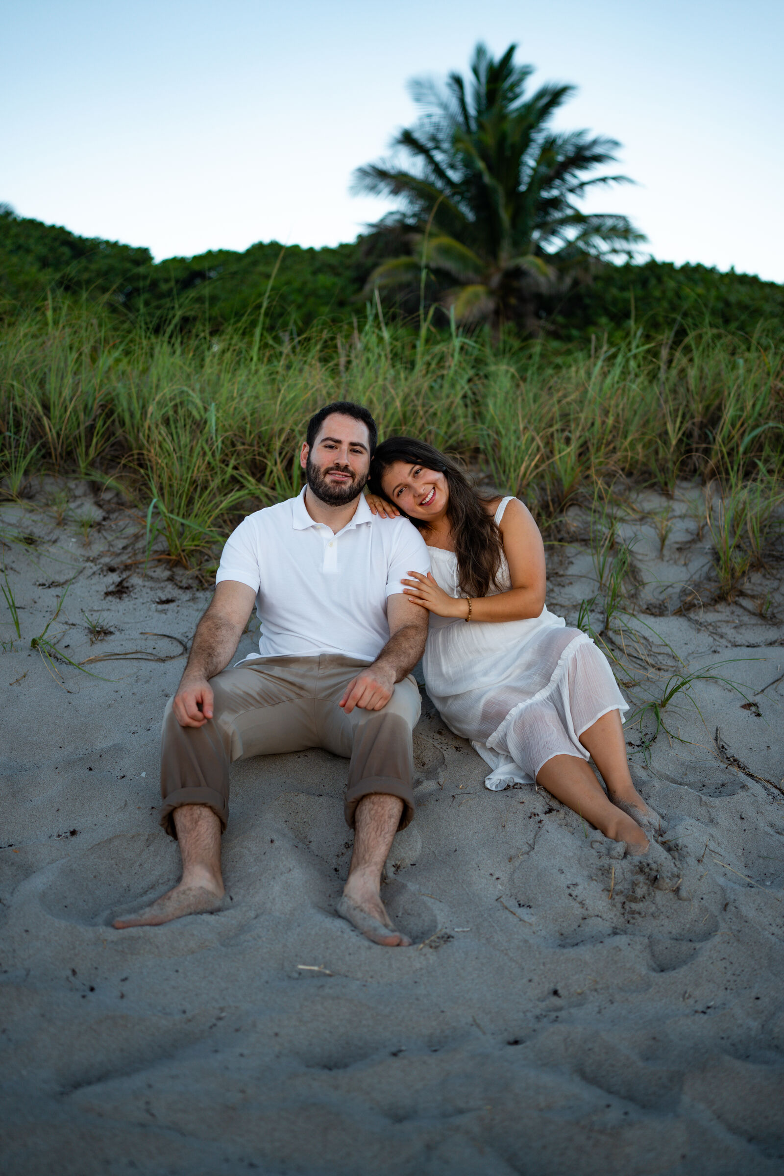 Couple sitting in the dunes