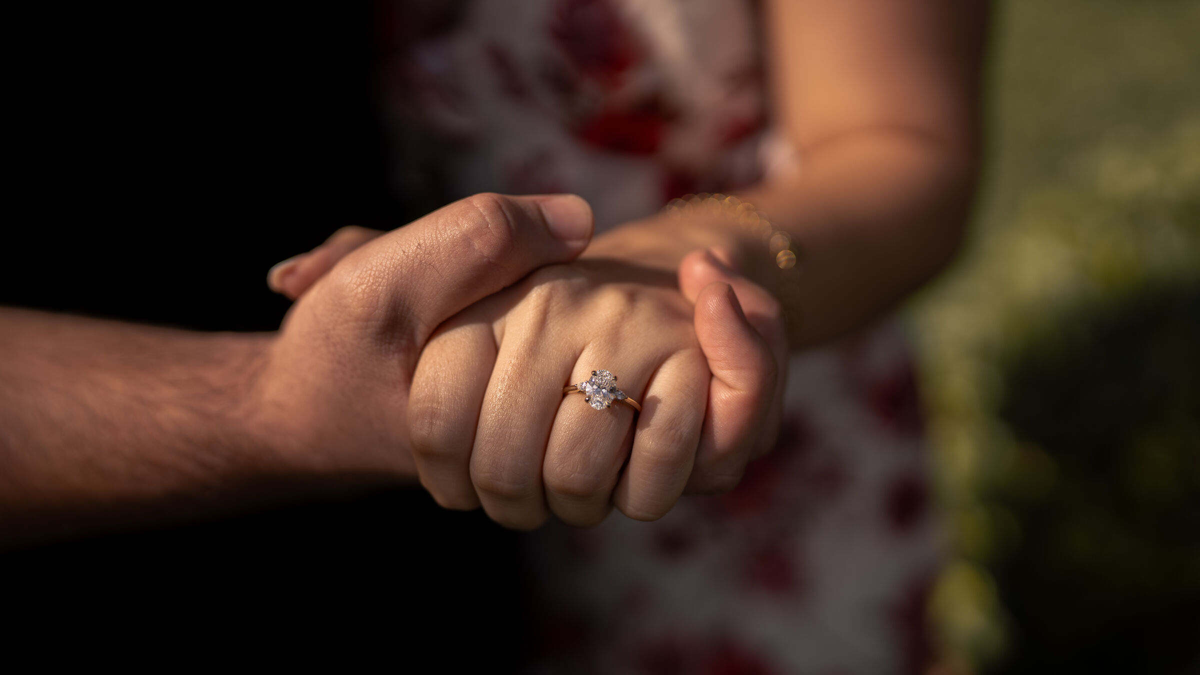 Hands held, ring in focus