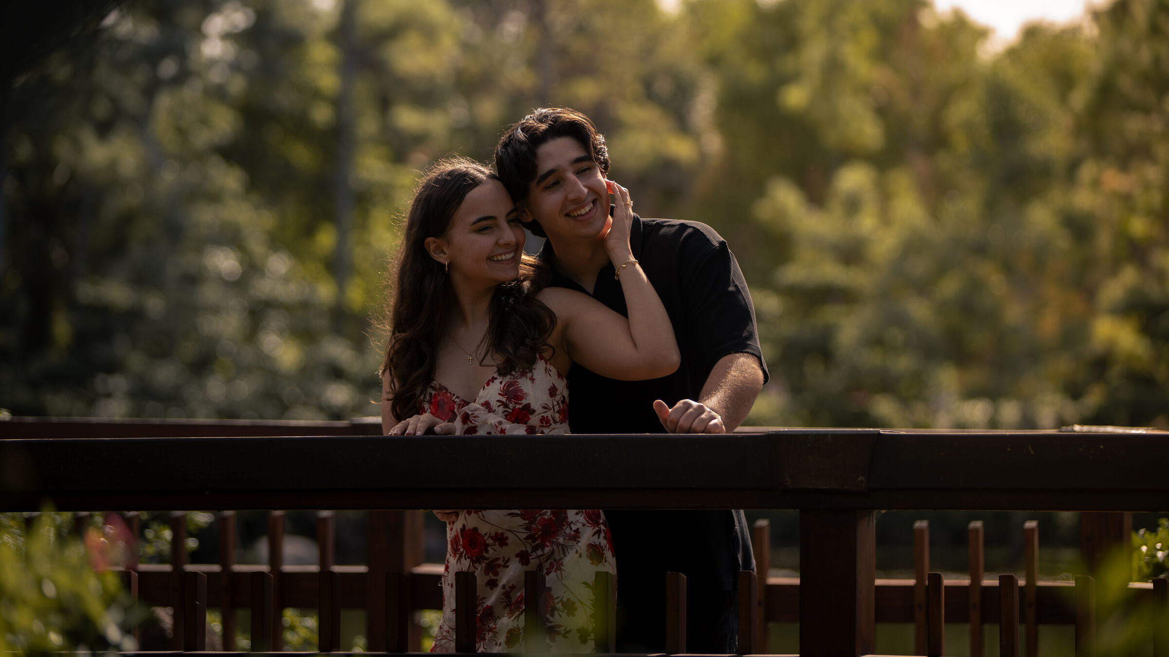 The couple laughing on the bridge